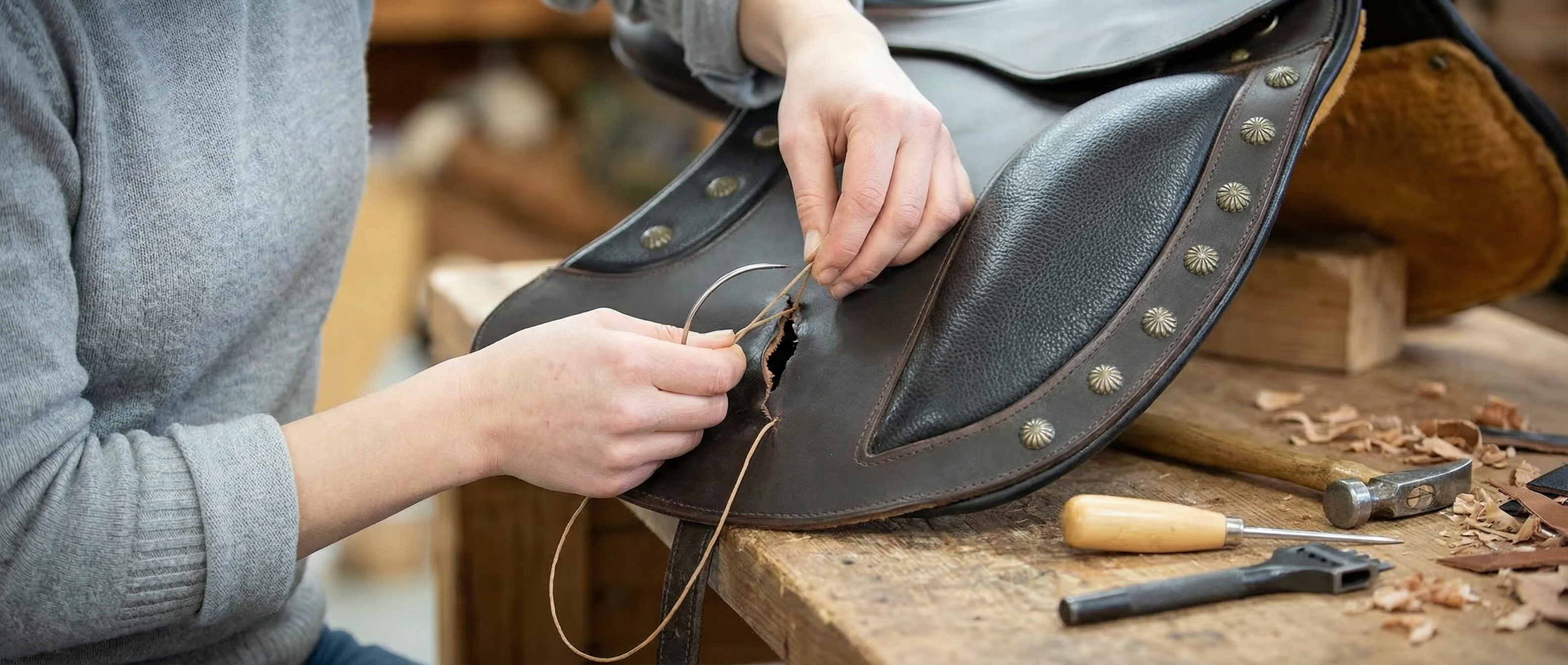 Firefly_GeminiFlash_create_me_an_image_of_someone_repairing_a_saddle_790209.png